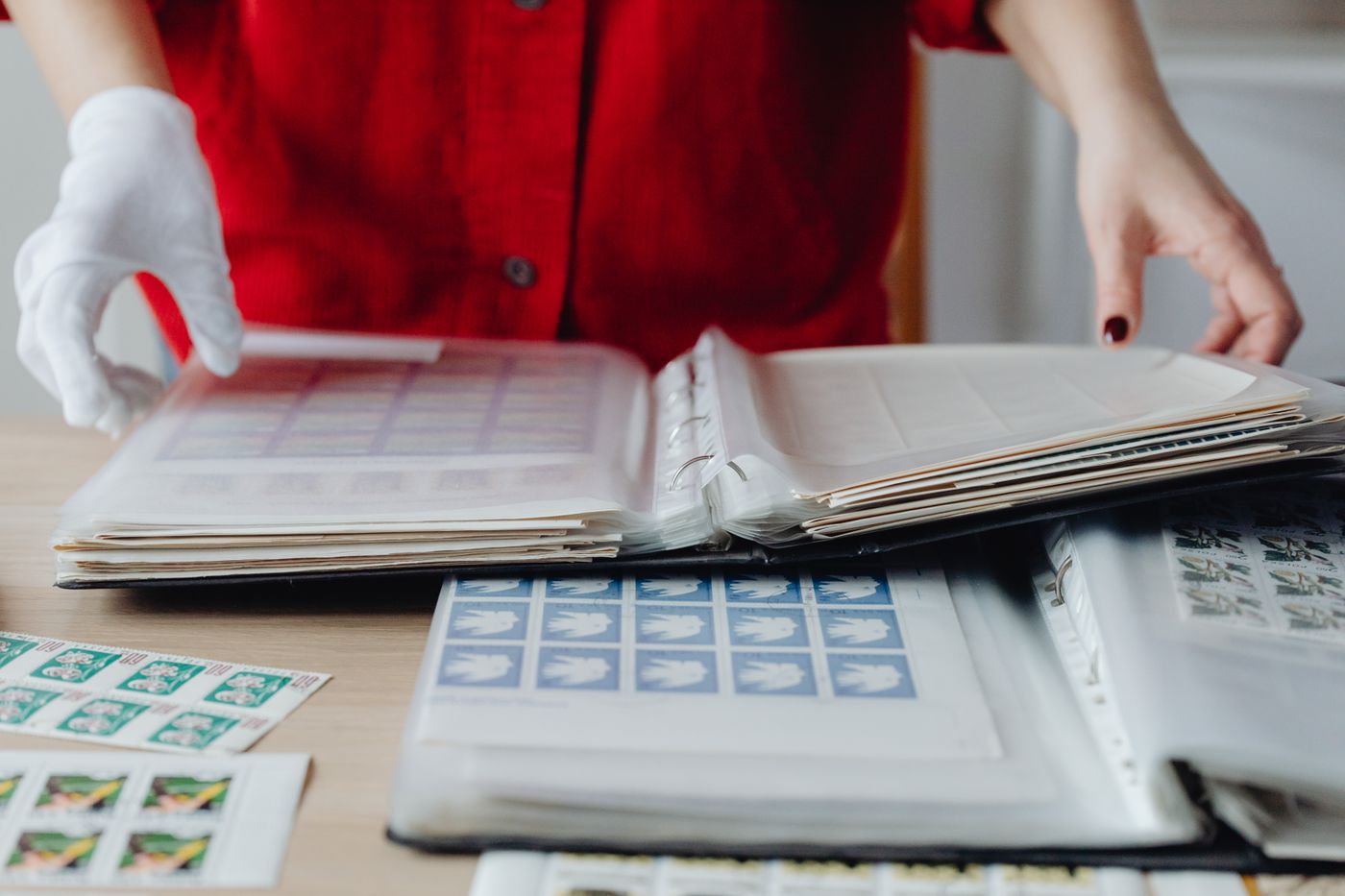Open stamp albums on a table